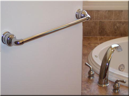 Bathroom towel bar and faucet.